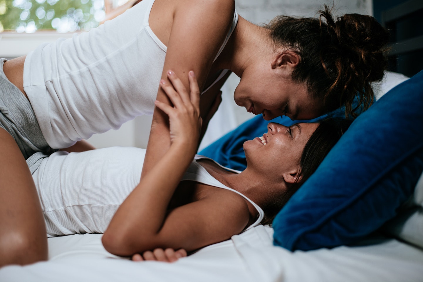 Gay couple happy in bed