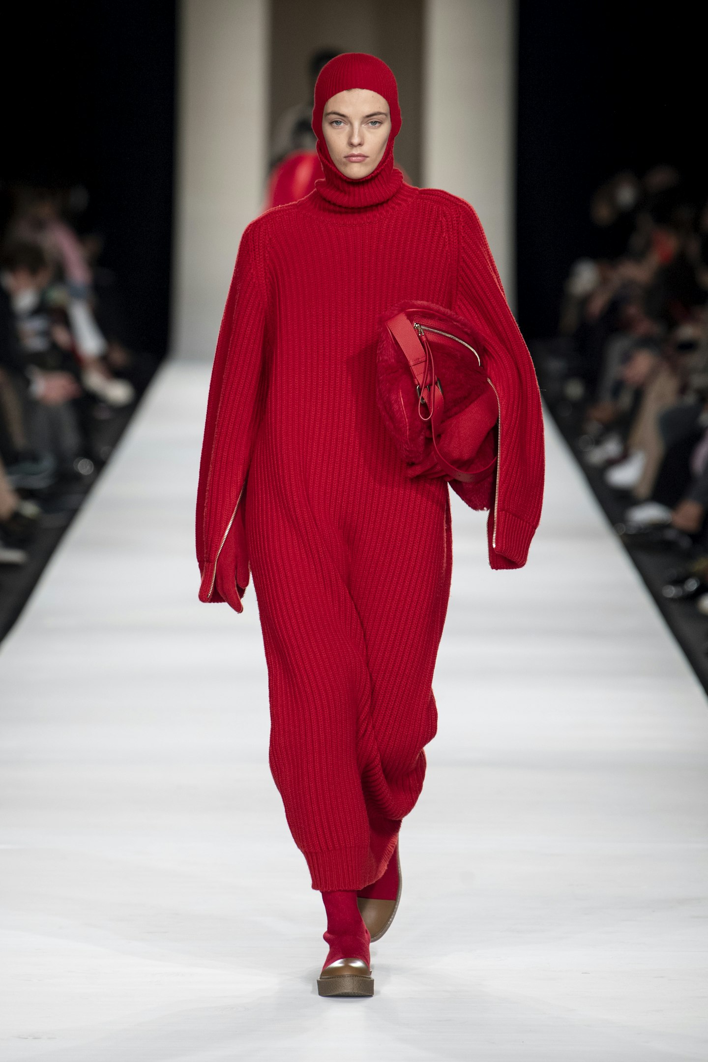 Woman with Gucci red leather bag before Max Mara fashion show