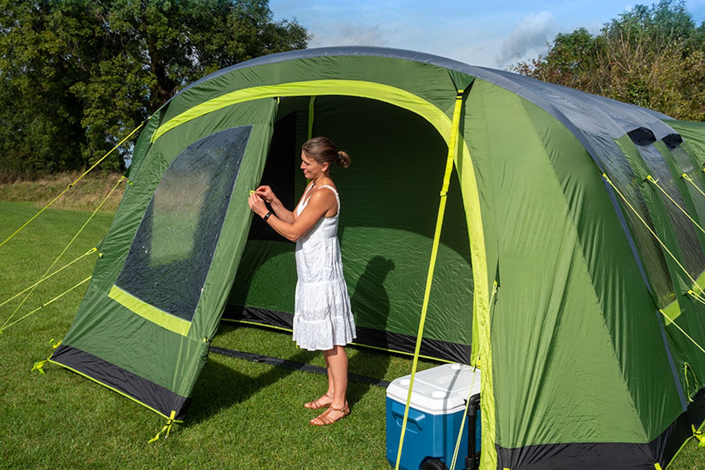 Woman unzipping tent