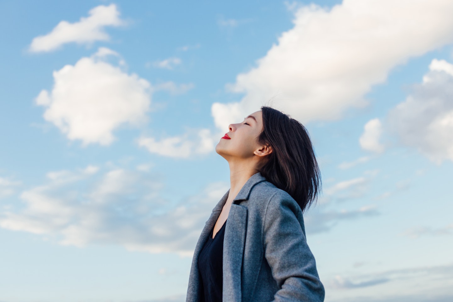 woman looking content with eyes closed