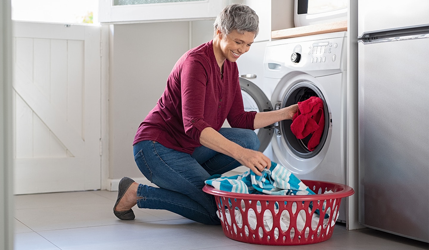 woman using tumble dryer