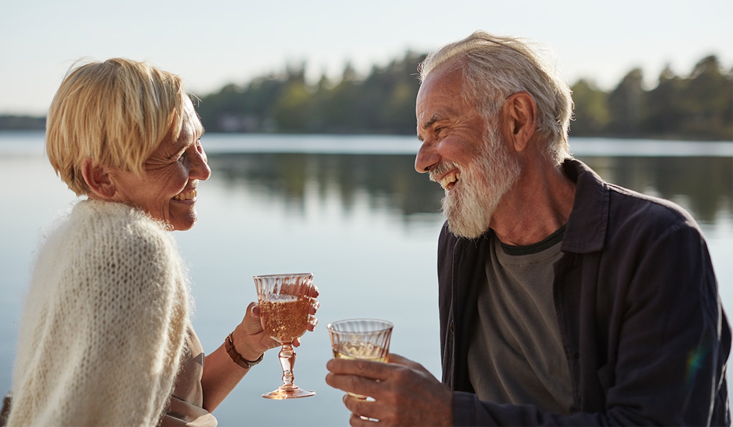 couple enjoying drink on beach