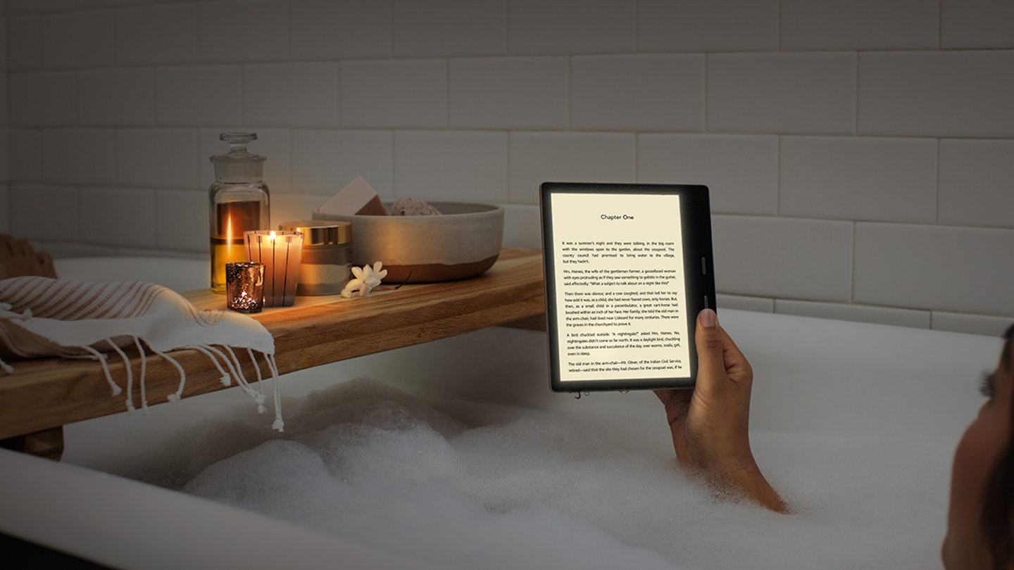Woman using Kindle Oasis in bath