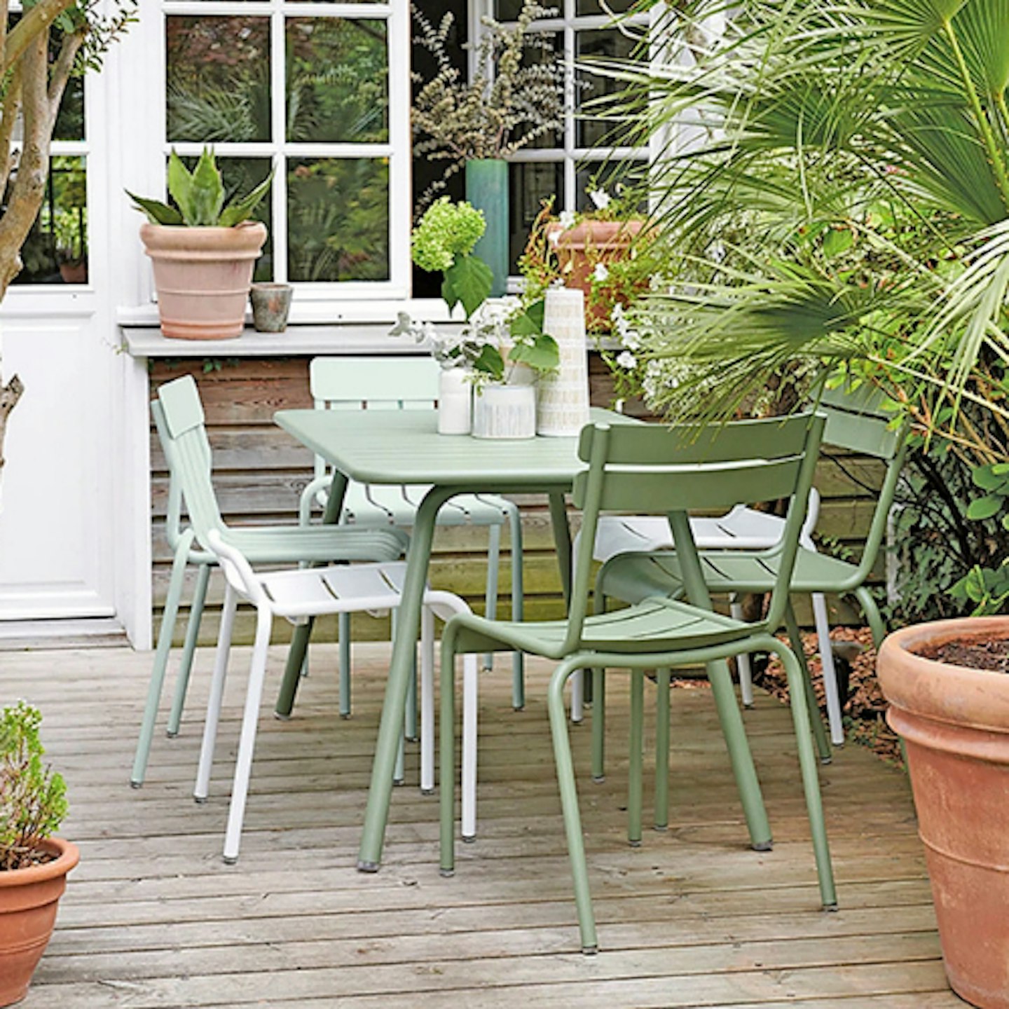 green garden table on shady deck