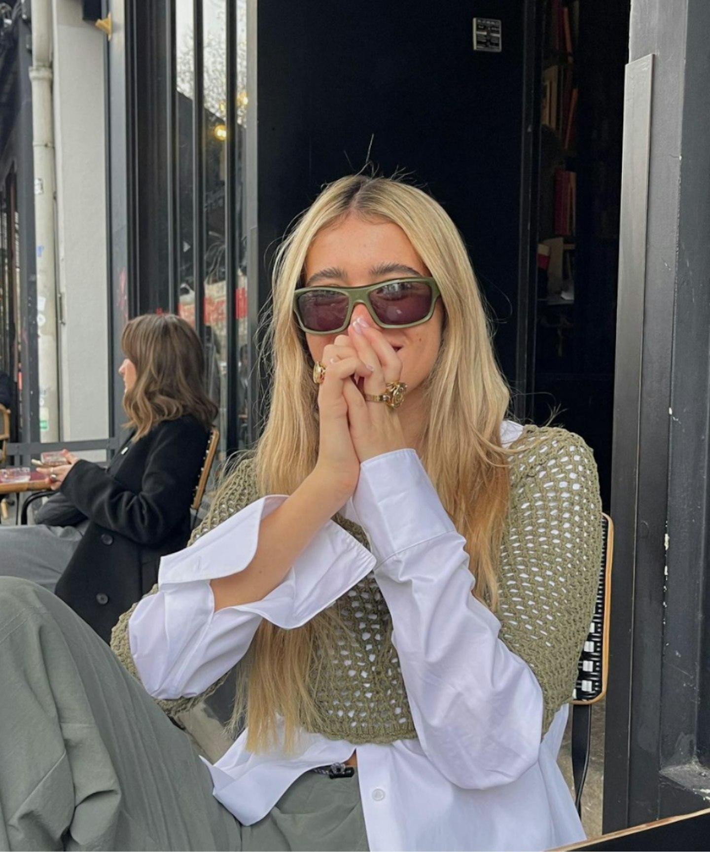 olivia-neill-instagram-outfit-paris-crochet-top-sipping-coffee