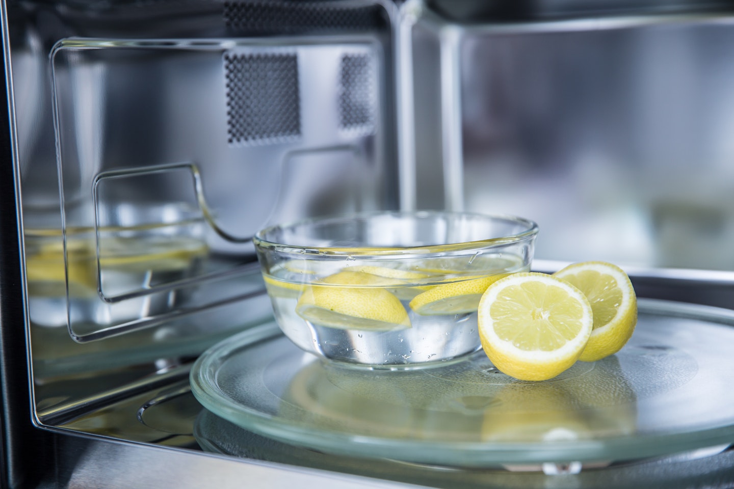 cleaning microwave with a lemon