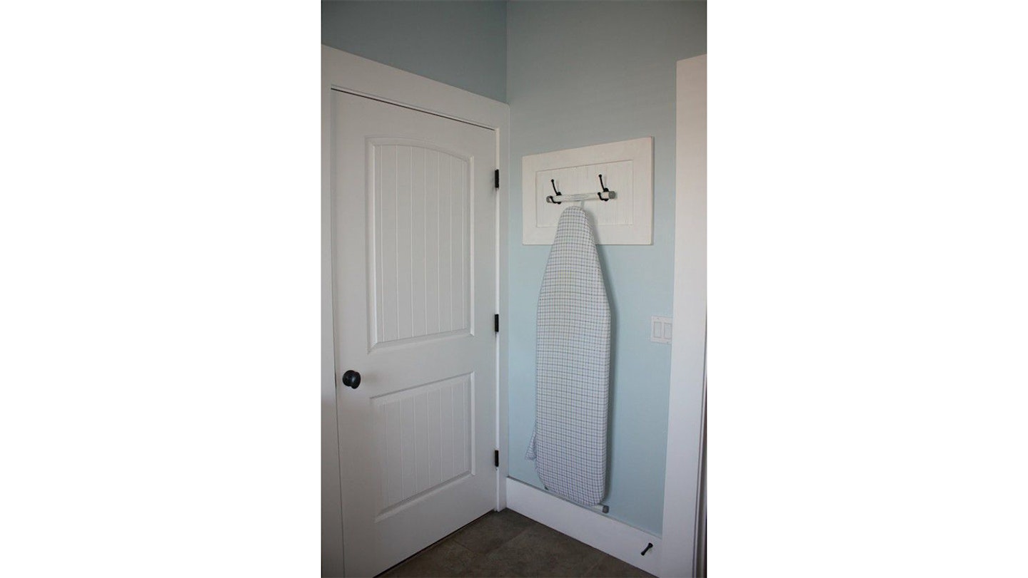 Ironing board on hooks