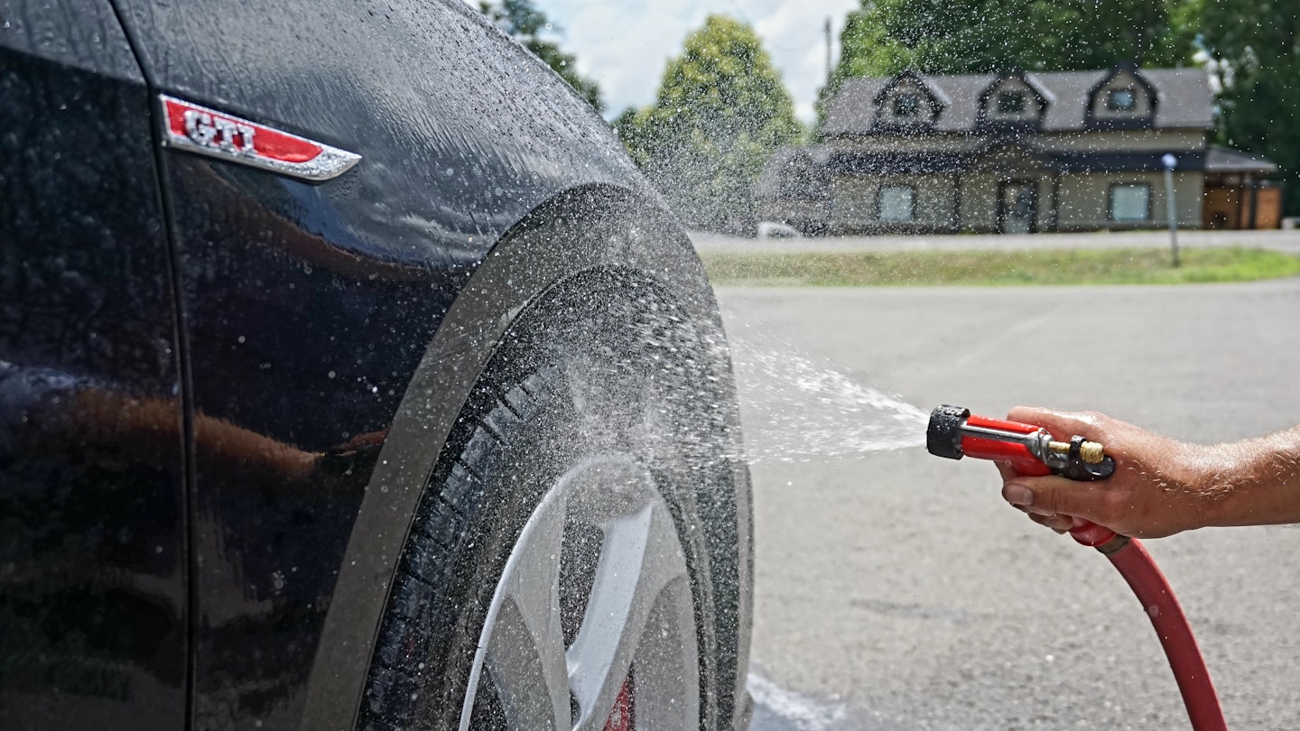 Washing a car with best hosepipe