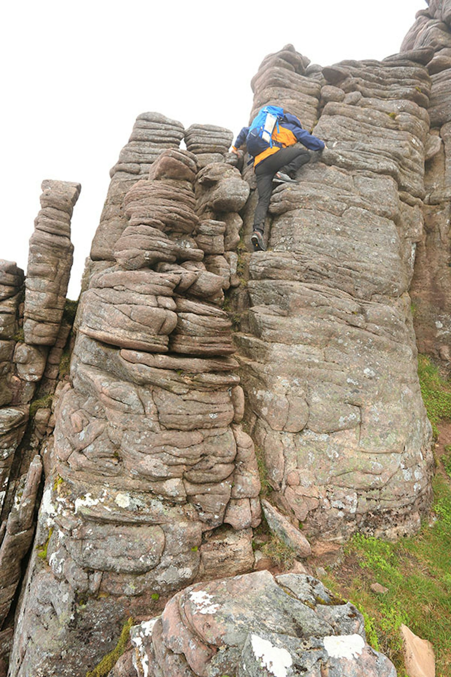 Clambering on the rounded, wind sculpted sandstone of An Teallach.