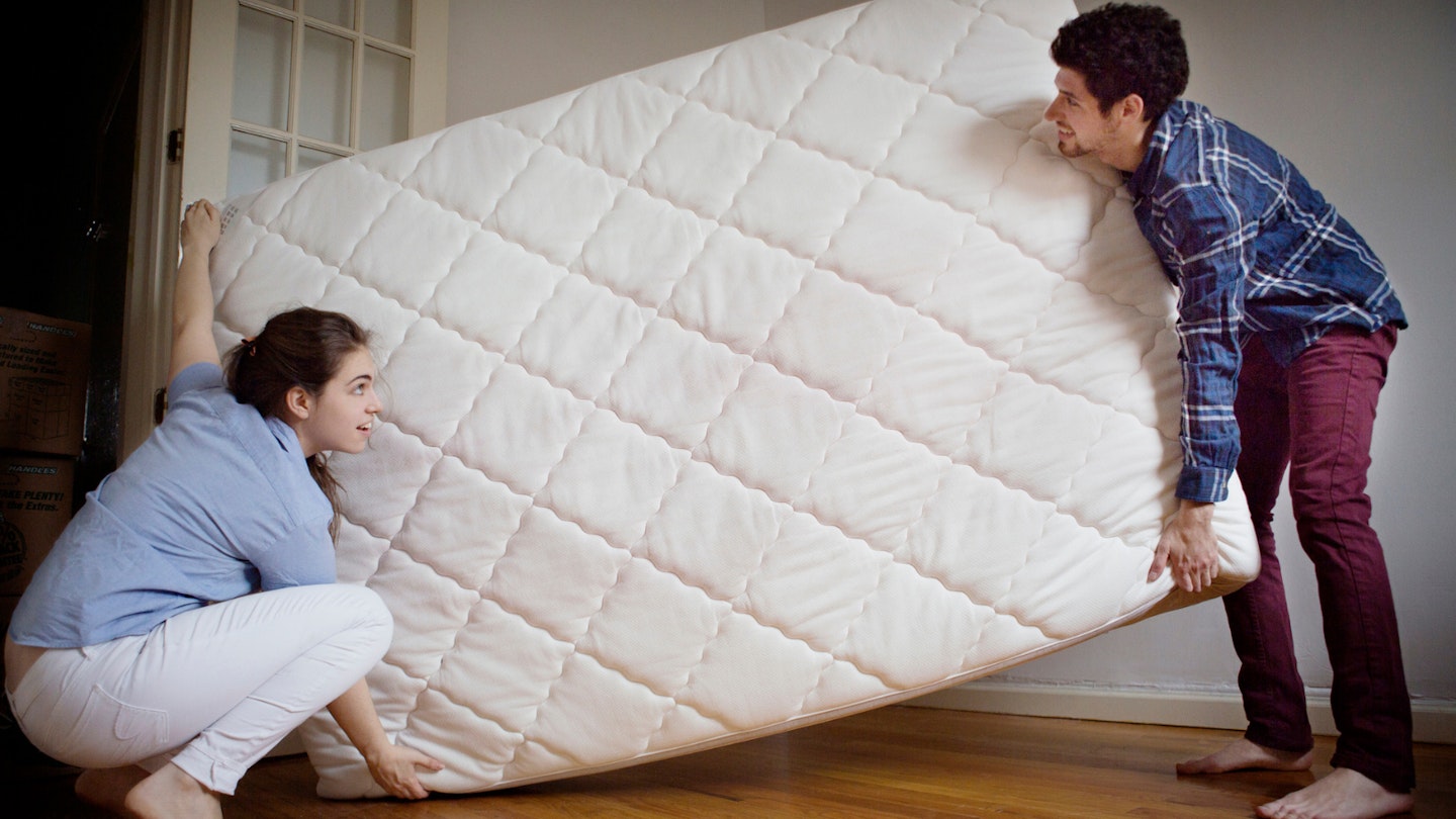 Couple removing mattress: how to dispose of a mattress