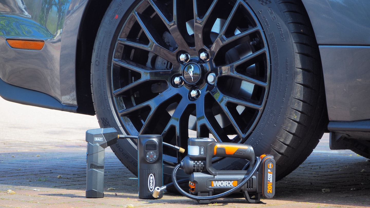 Sealey CTI120, Ring RTC2000, and Worx WX092 beside a car wheel