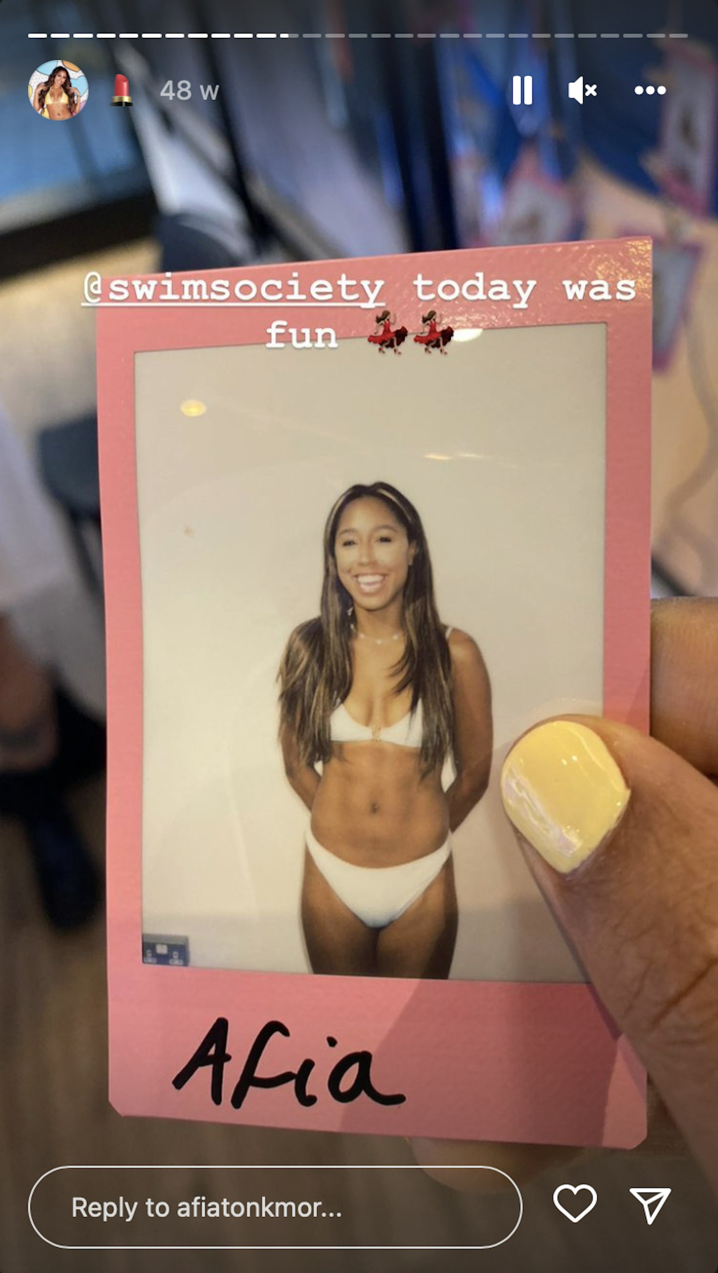 Afia models a Swim Society swimsuit