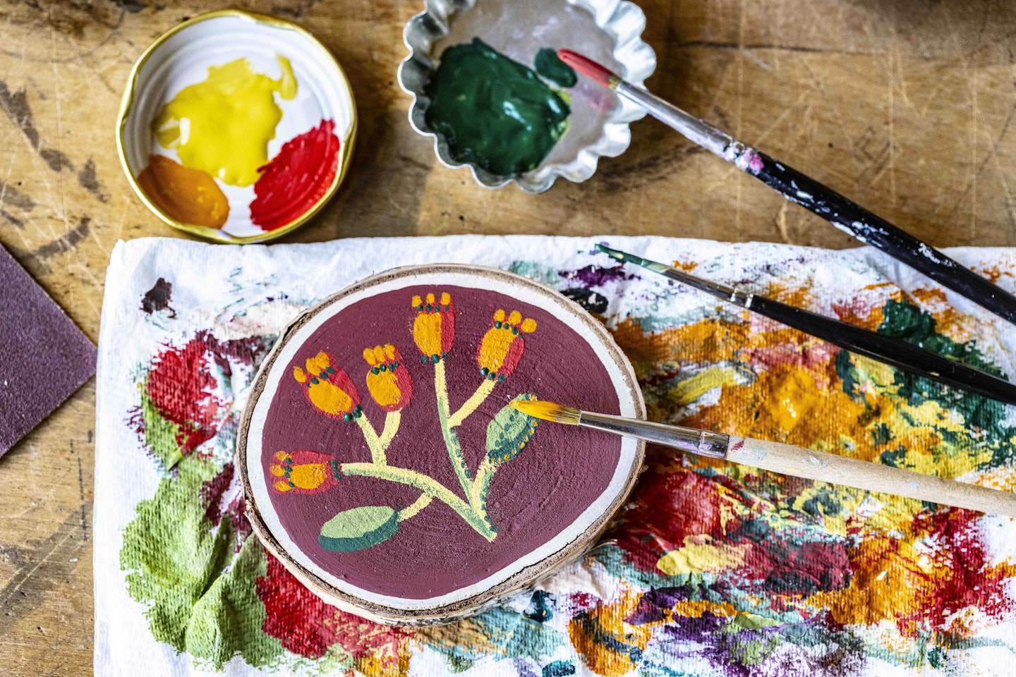 Painted wooden slices from the craft project in the October issue of LandScape magazine.