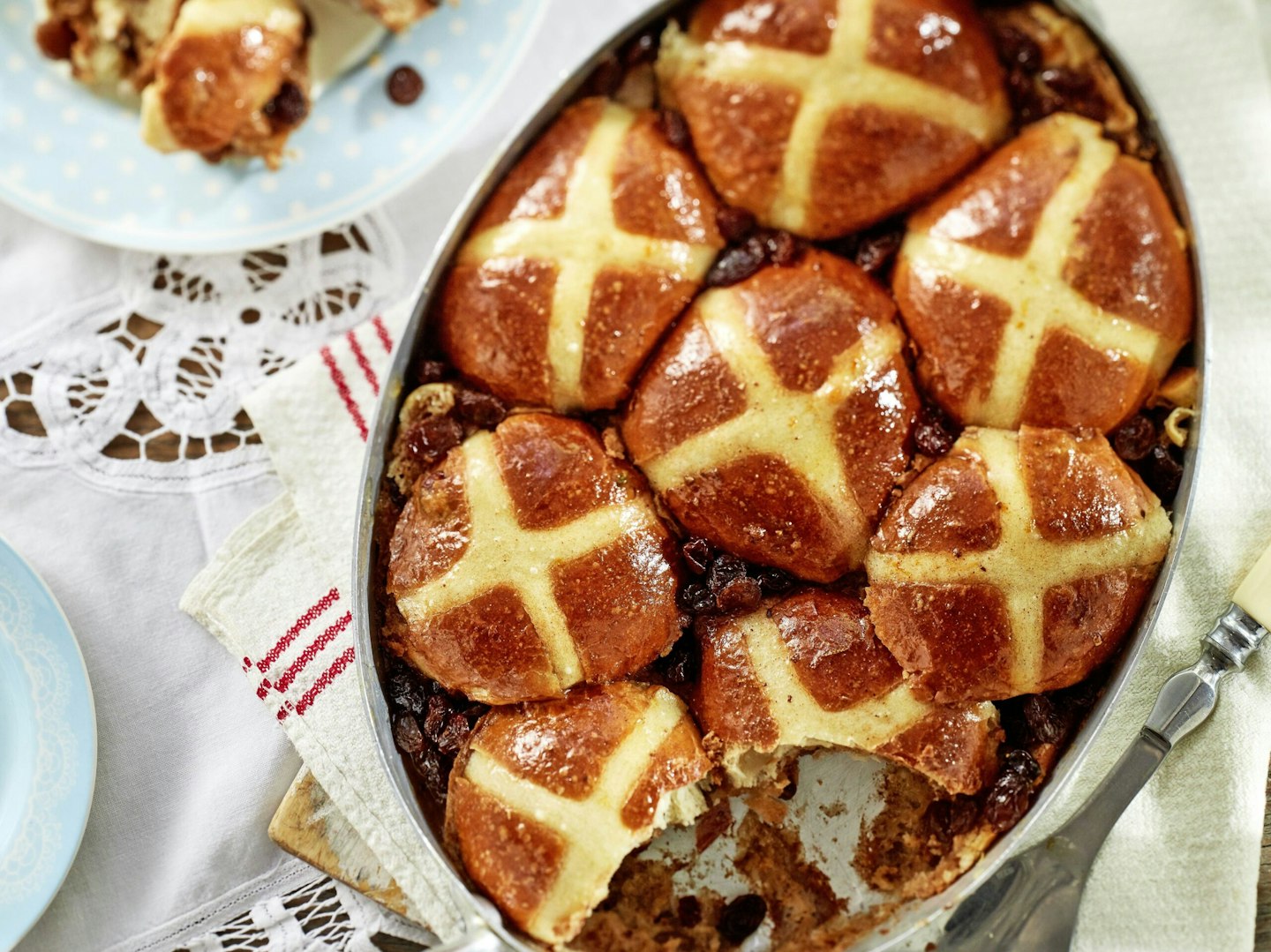 Hot cross bun bread and butter pudding on a spring table