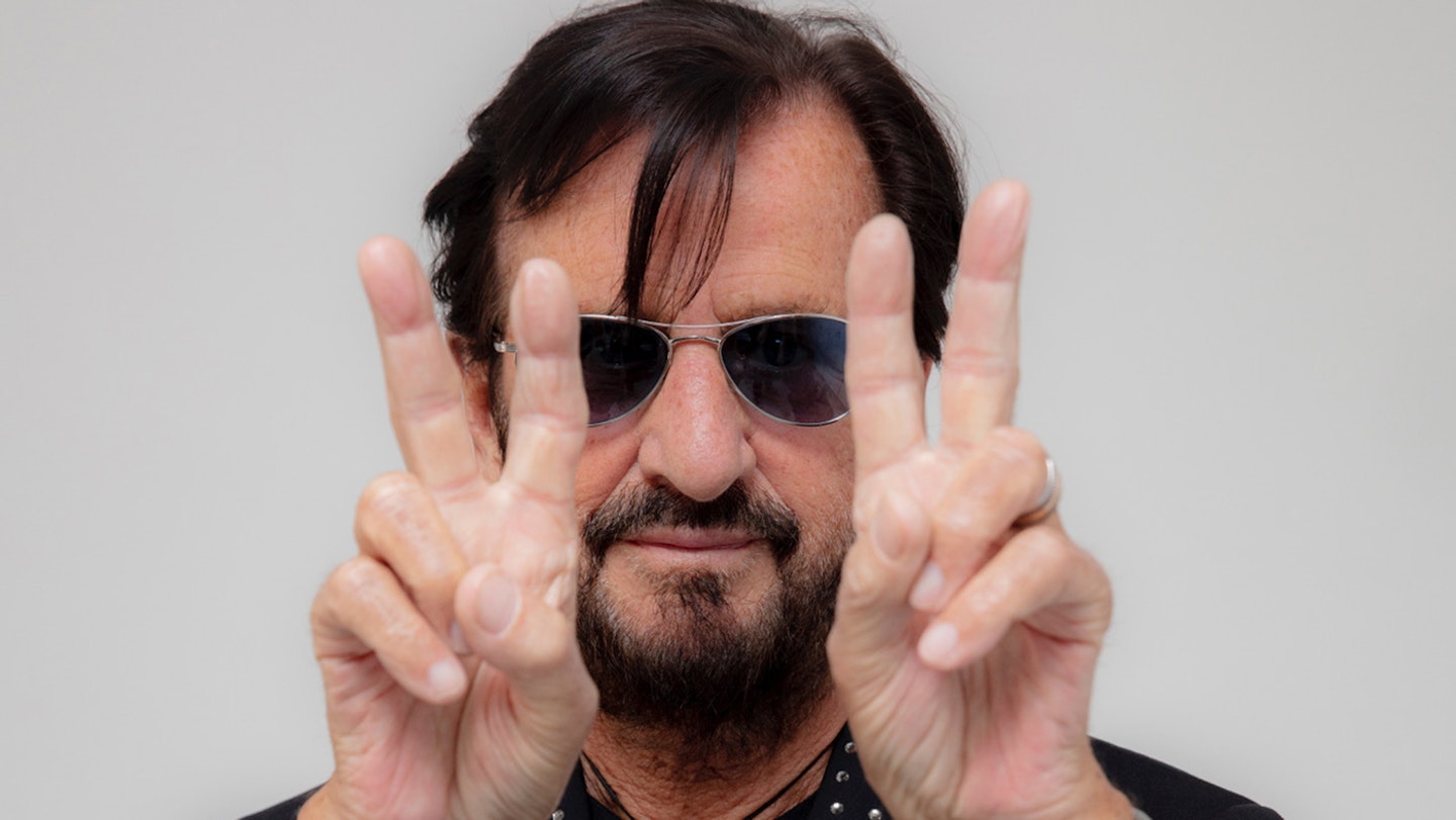 Ringo Starr Giving The Peace Sign