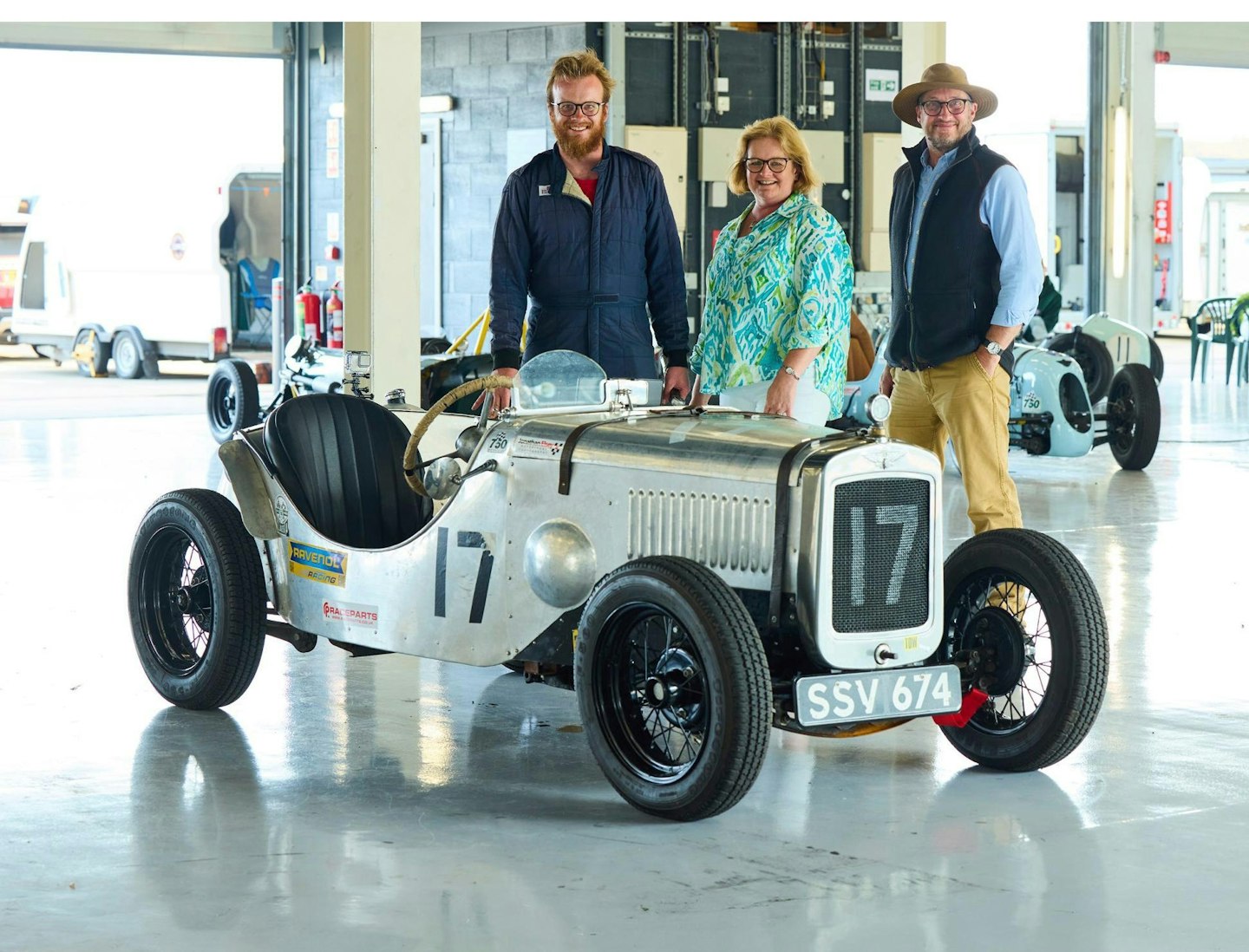 Matt with his mum and dad, and the car he built