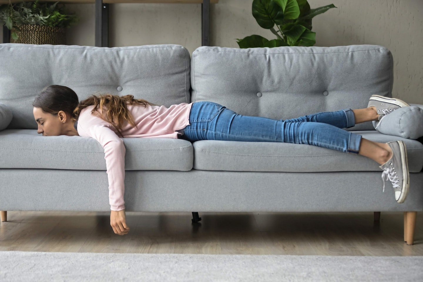 Woman bored on sofa
