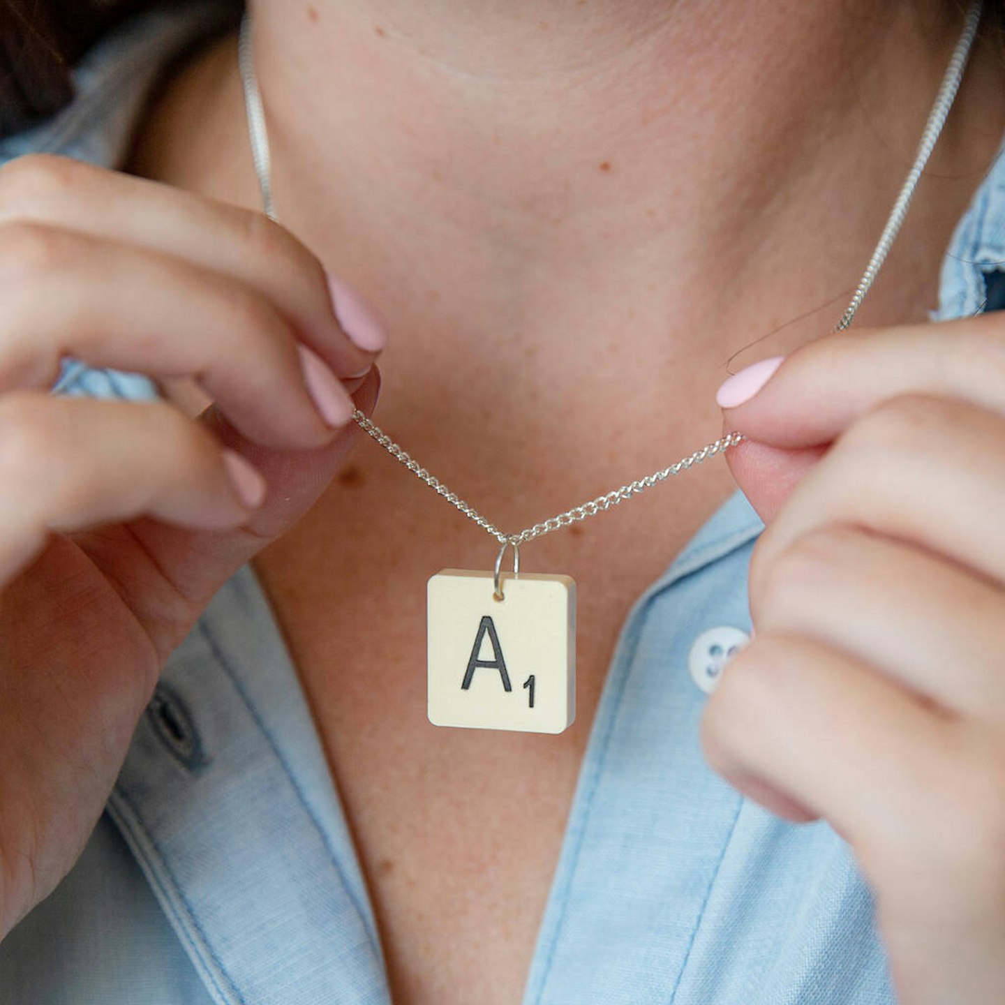 Vintage Letter Tile Personalised Necklace worn around neck. The letter A