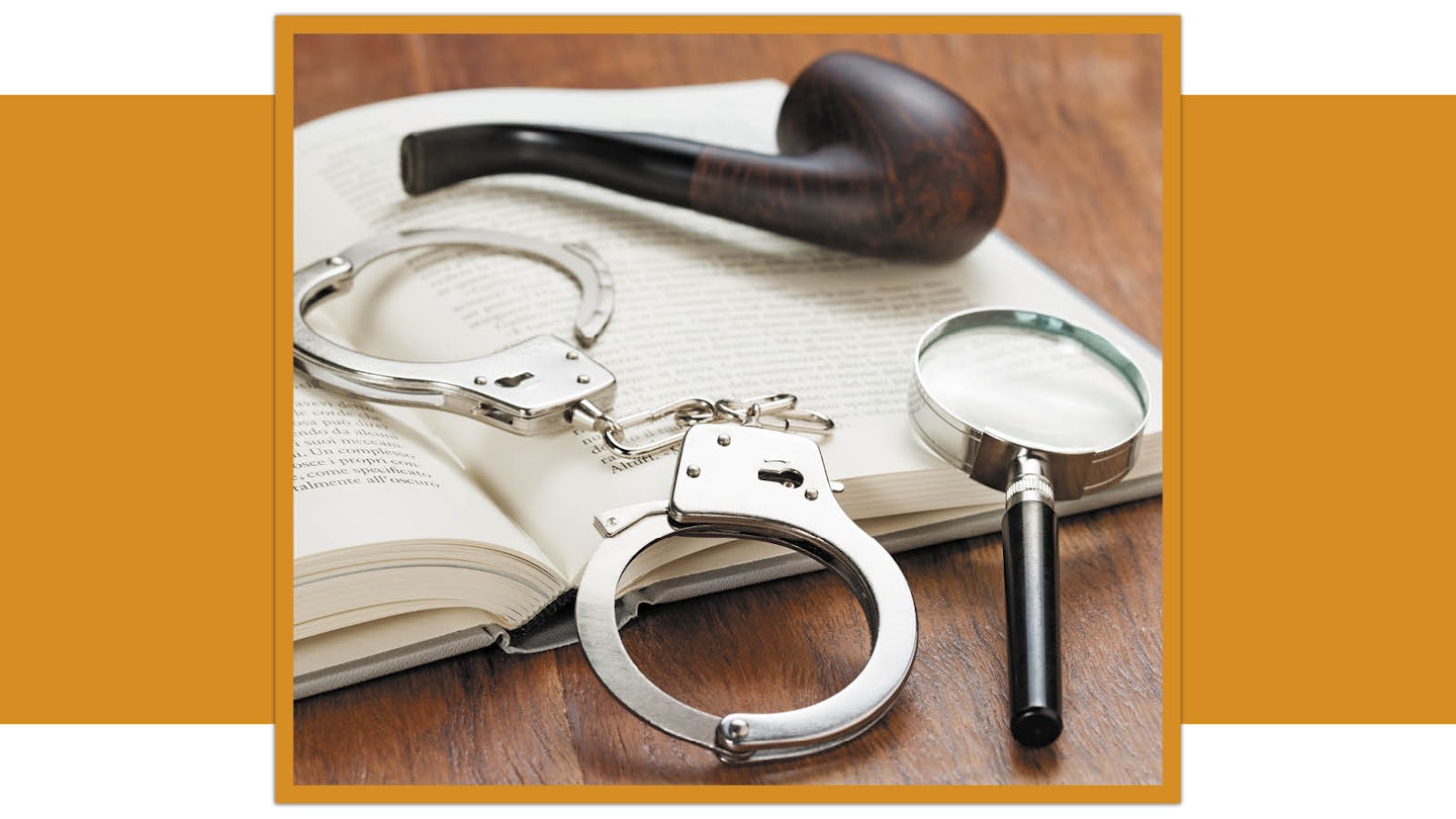 Handcuffs, pipe, magnifying glass, book, mystery novel