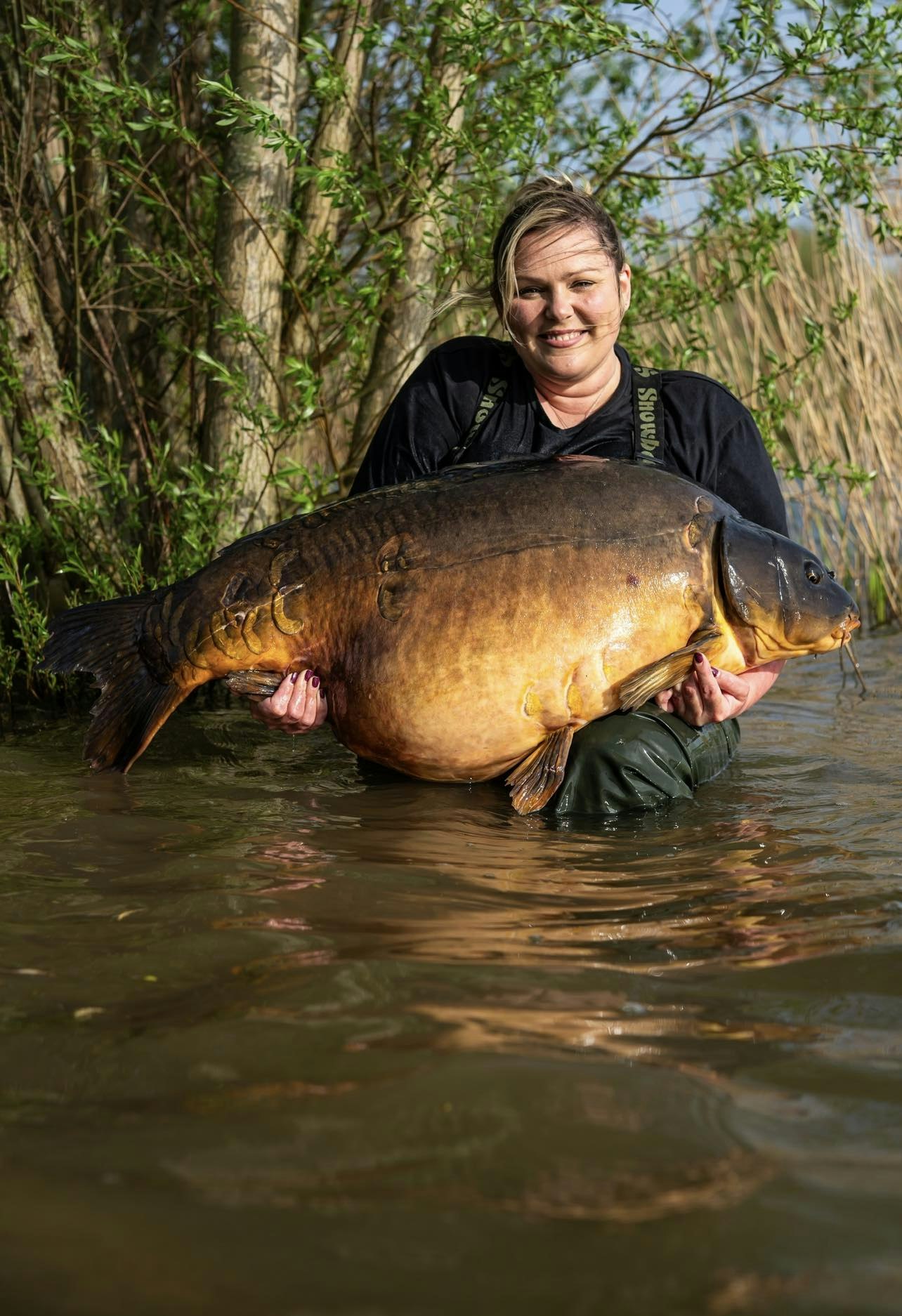 The elation says it all, Naomi with her PB carp at 72lb 12oz.
