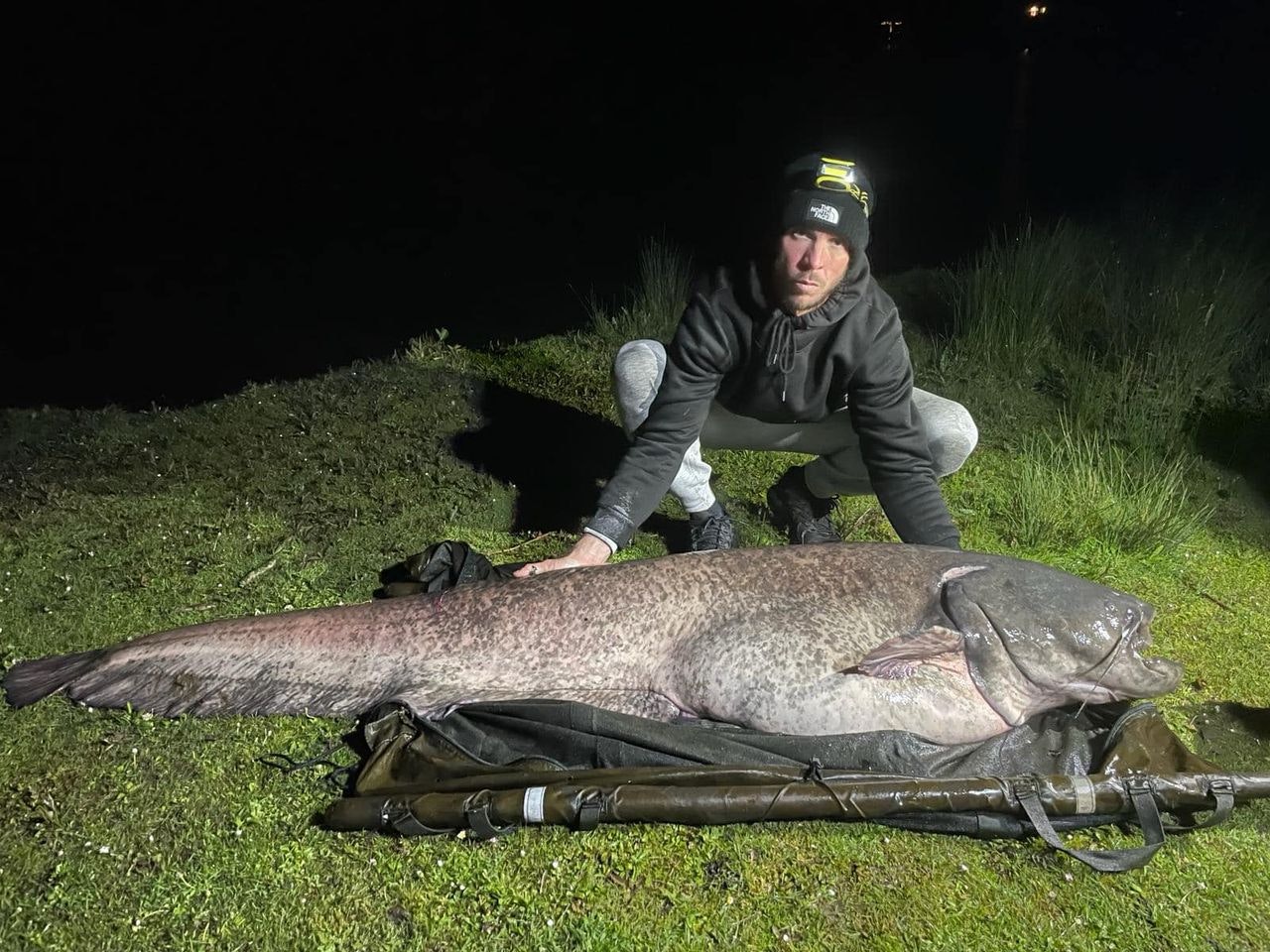 Darren Reitz with his monstrous 143lb catfish.