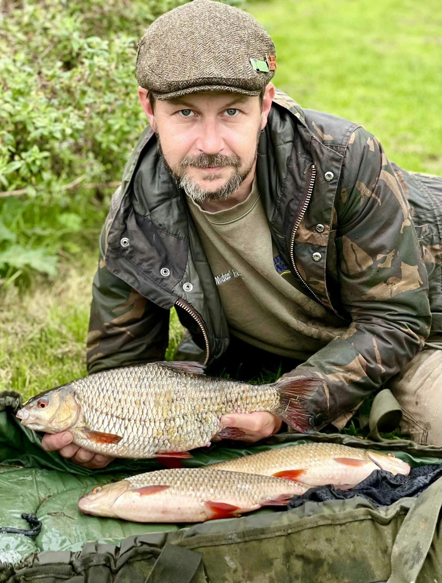 Mark Hewett holds up his 3lb 1oz Hants Avon roach.