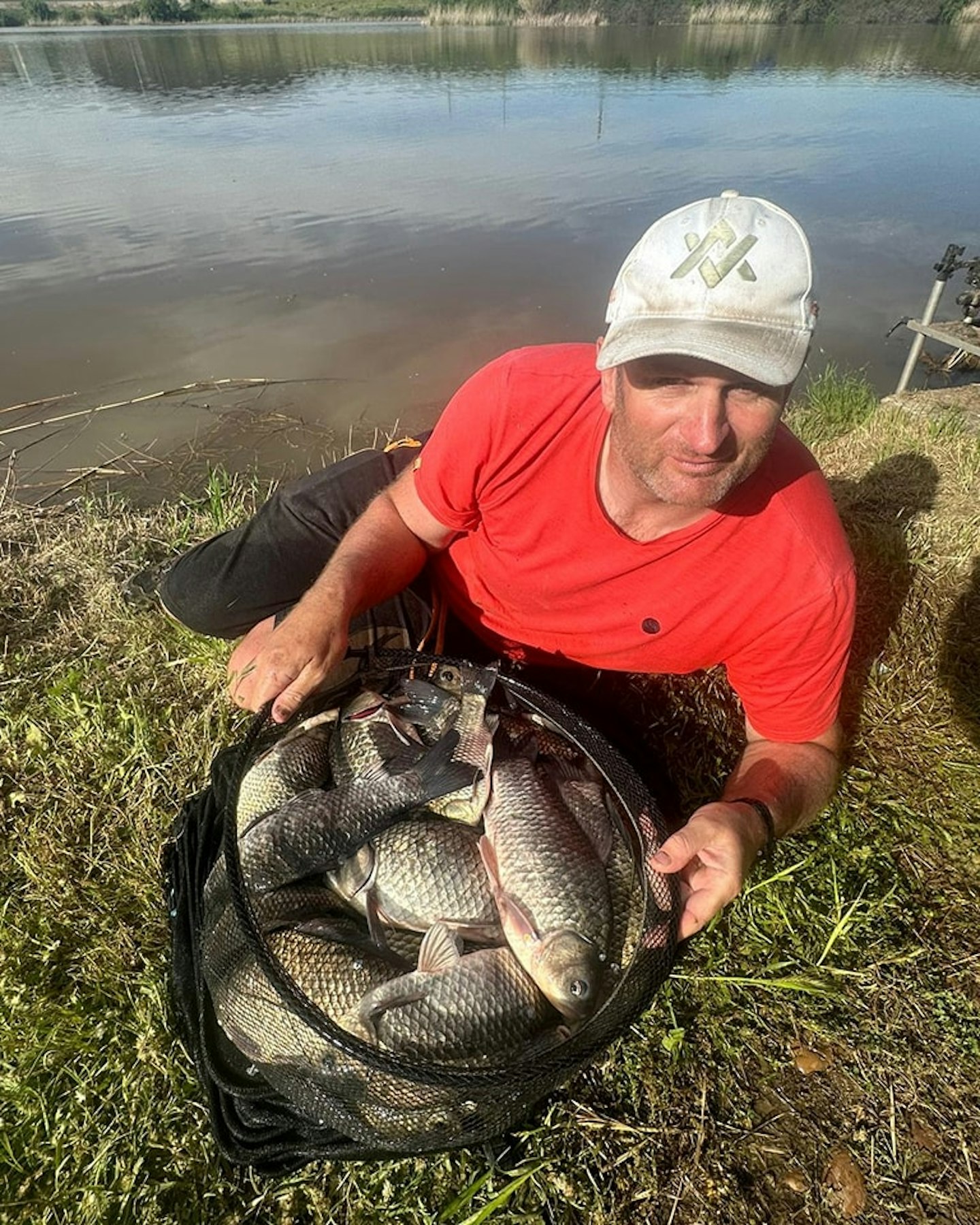 Steve Ringer with his carassio catch, a fish that will prove important.