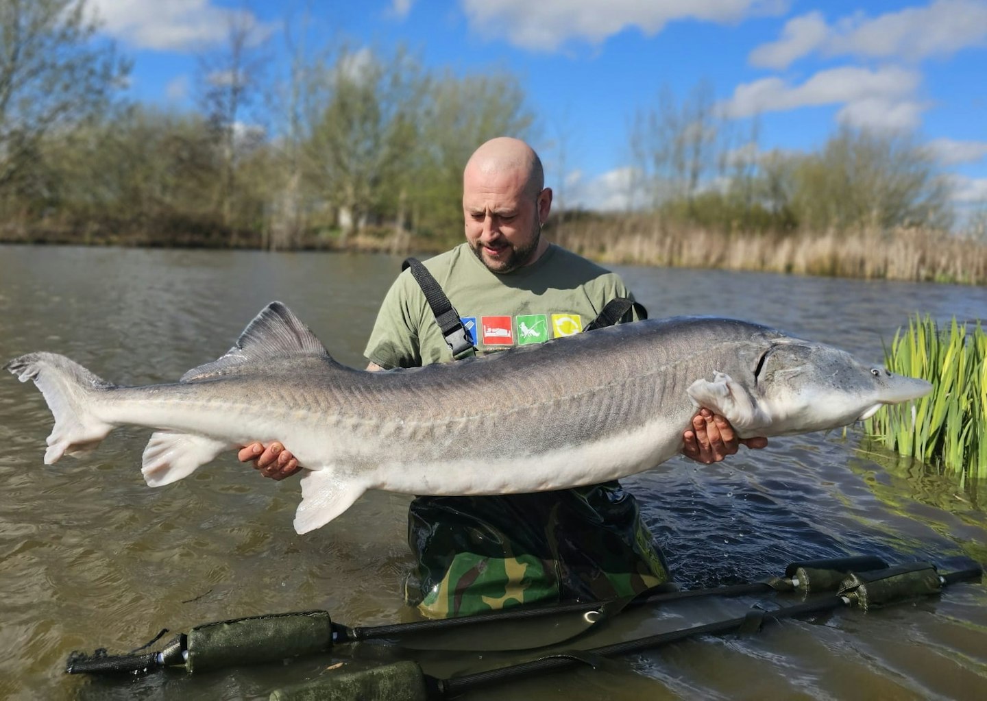 Sam Smedley with his giant 89lb, blank saving sturgeon.