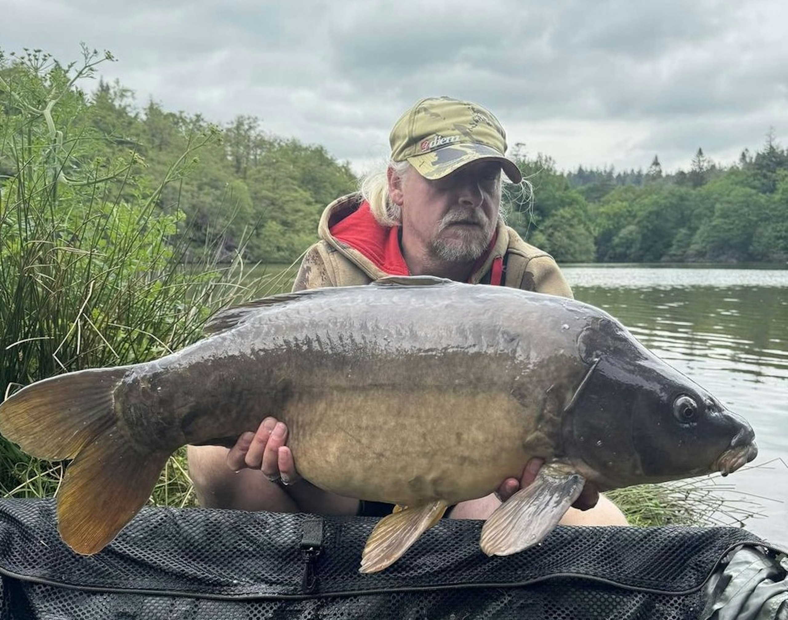 Phil Martin with one of the 105 carp they caught.
