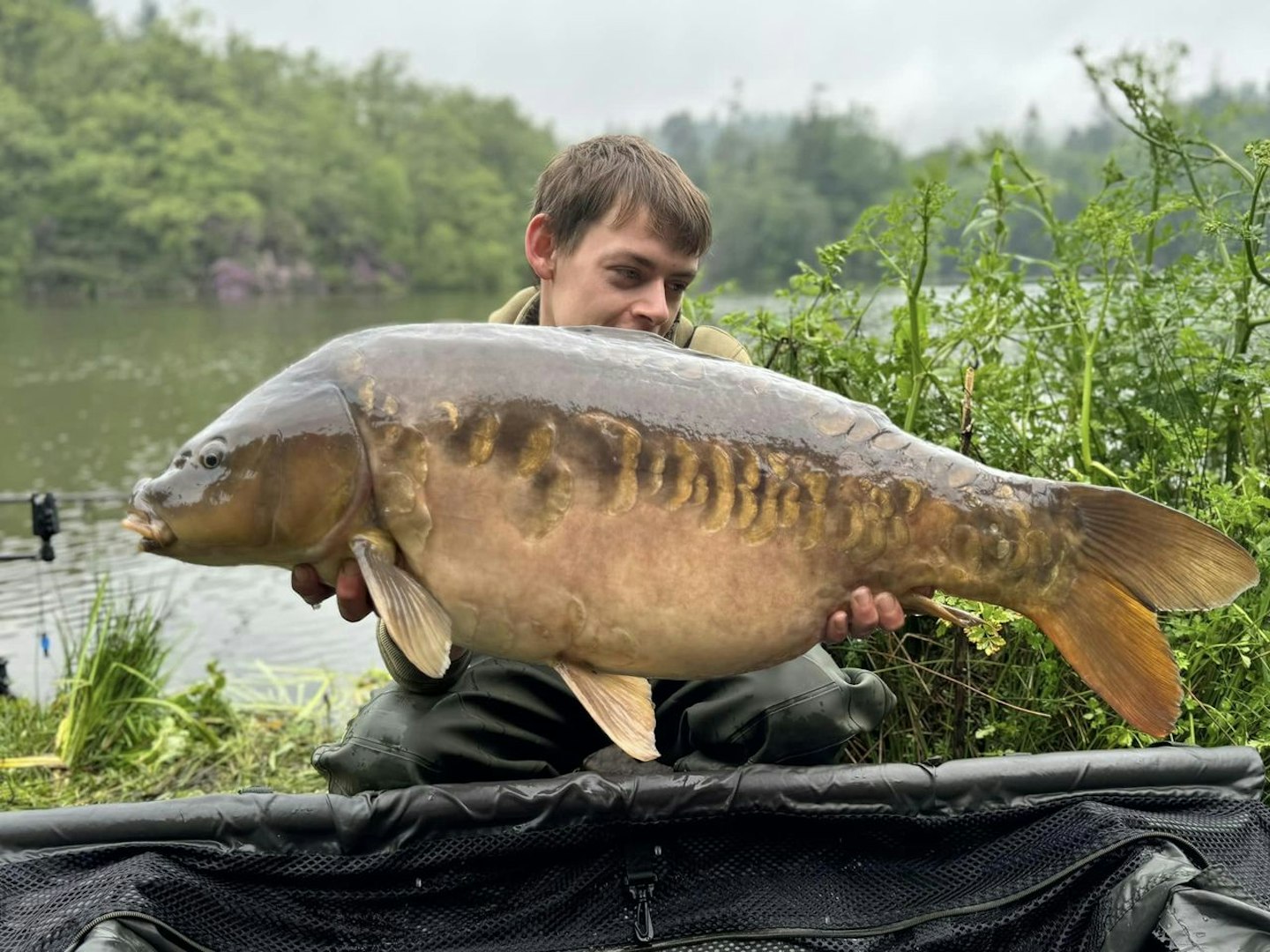 Brandon with the biggest fish of the trip, a lovely 30lb mirror.