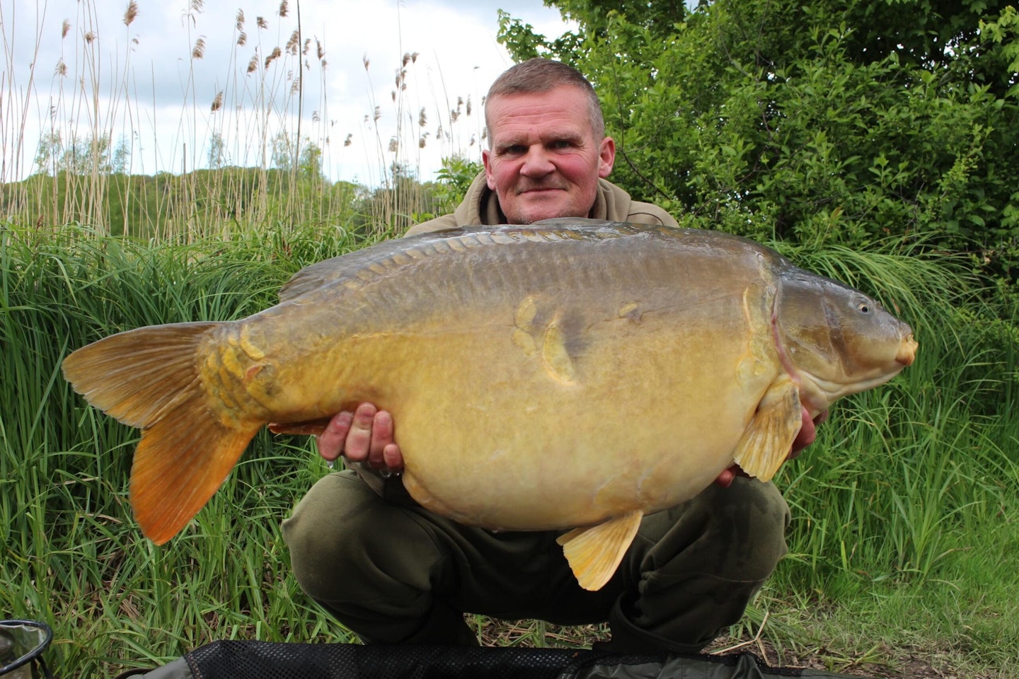 Adam with one of his "smaller" carp that went 47lb.