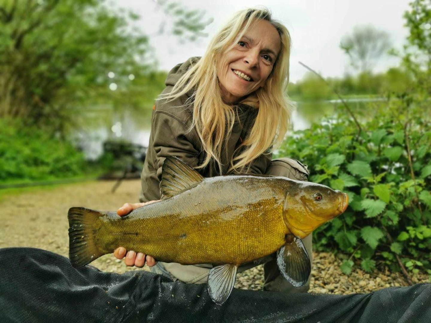 Iwona Kepa with a scale perfect tench.