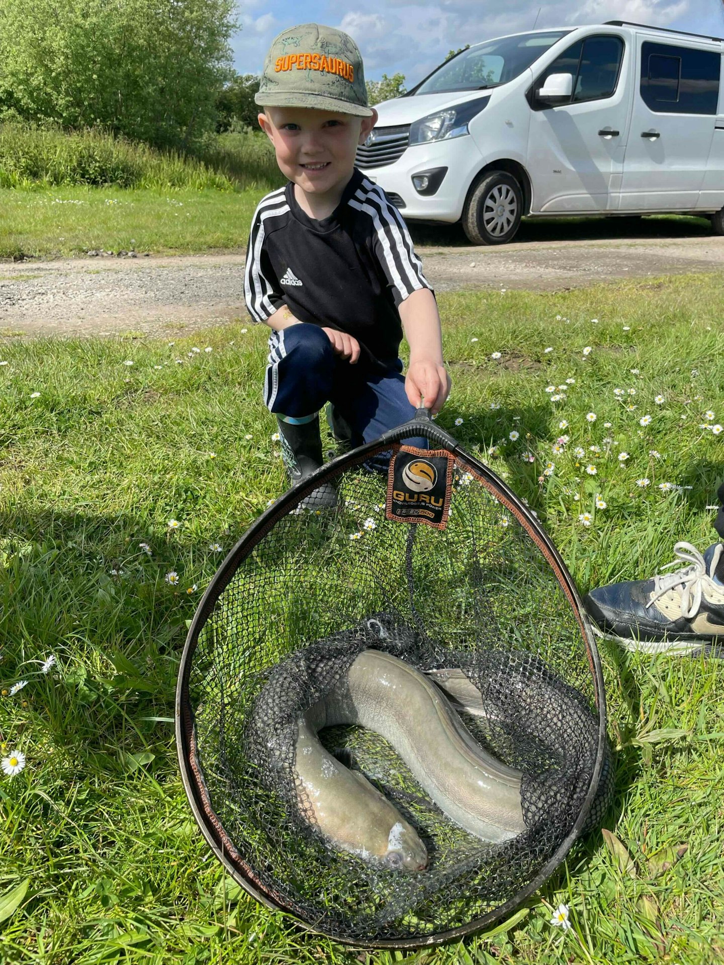 Five-year-old Harry Burton with his first ever fish, a 5lb 12oz eel.