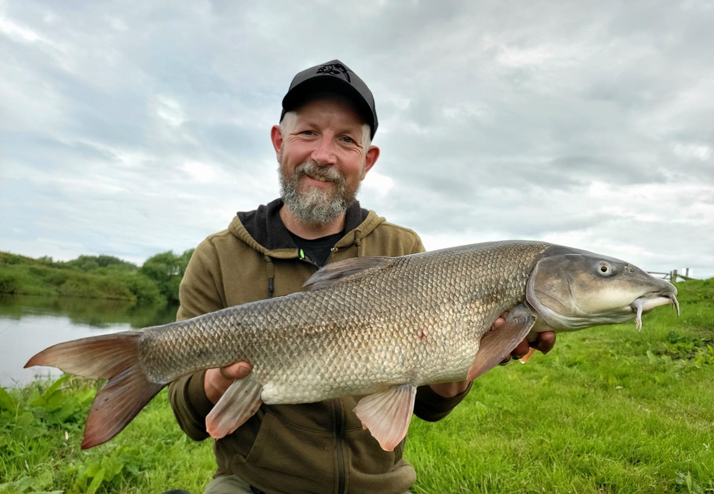 Andy Waters with his superb PB barbel.