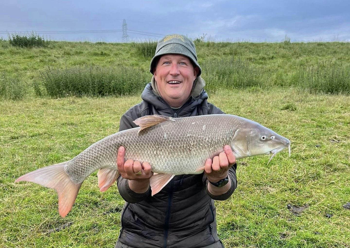 Kes with his new barbel PB of 16lb 12oz.