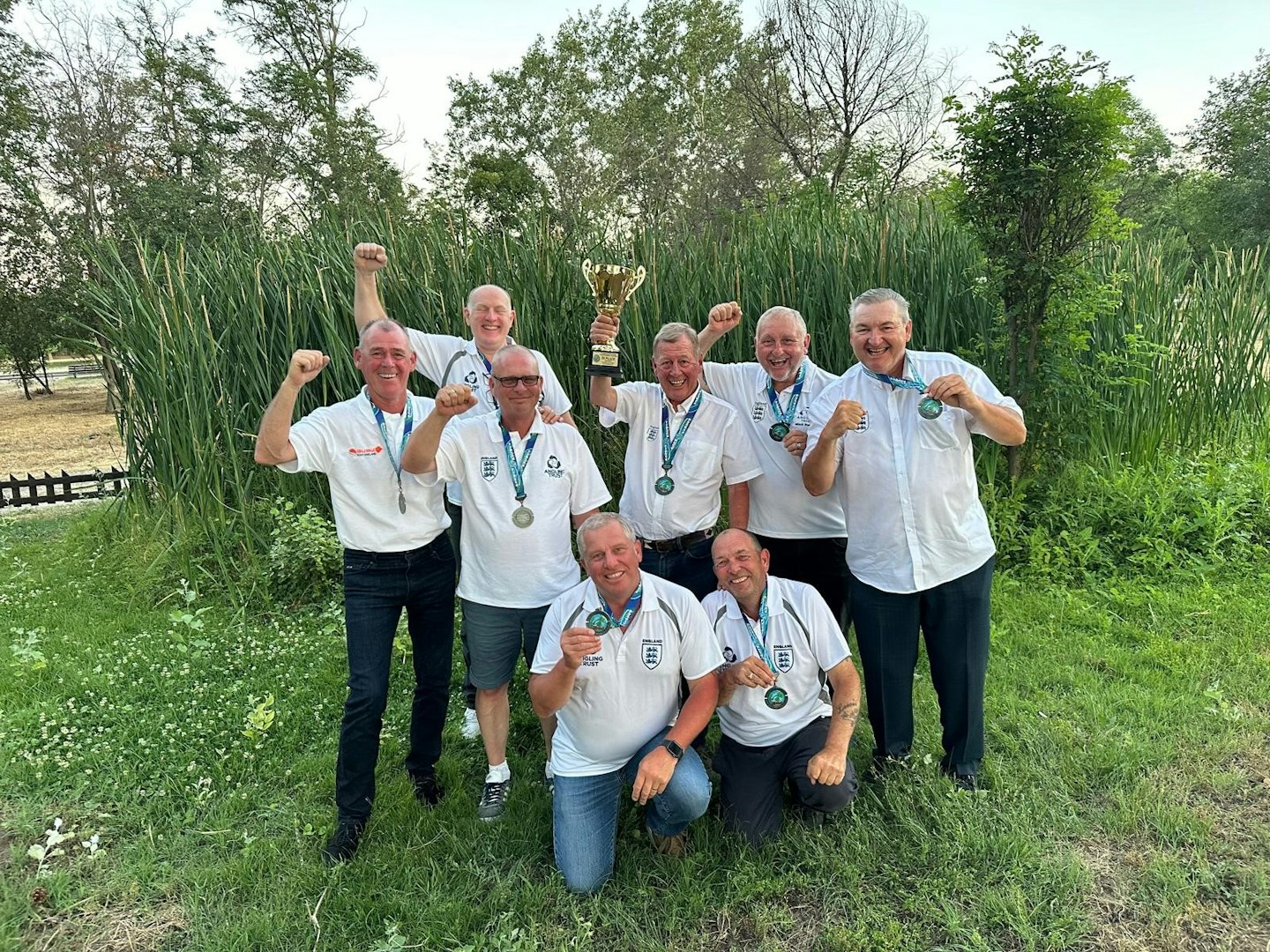 The England Masters Team elated with their bronze medal.