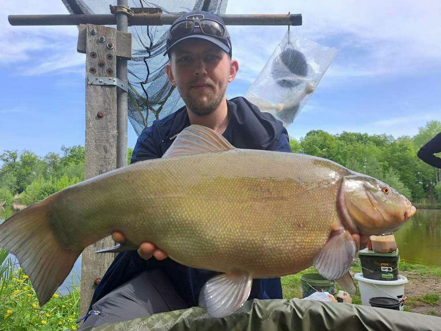 Connor with the massive tench caught on Lee's rod