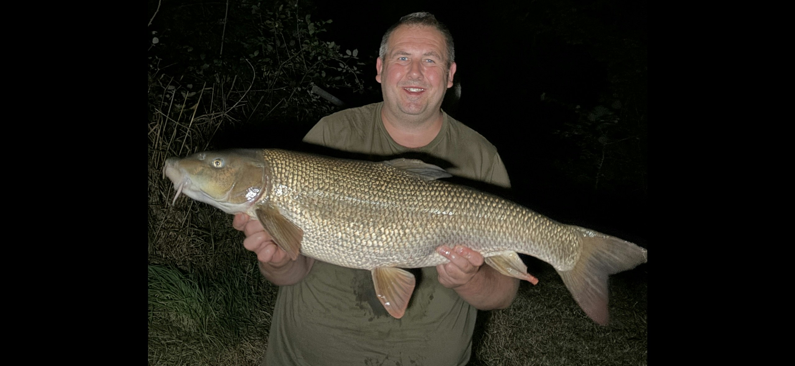 All smiles for Neale when he landed his 17lb barbel