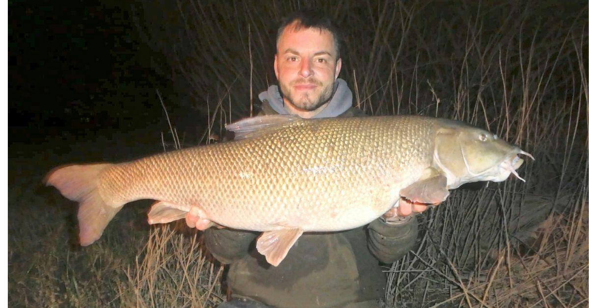 Luke holding the biggest barbel the Severn has produced