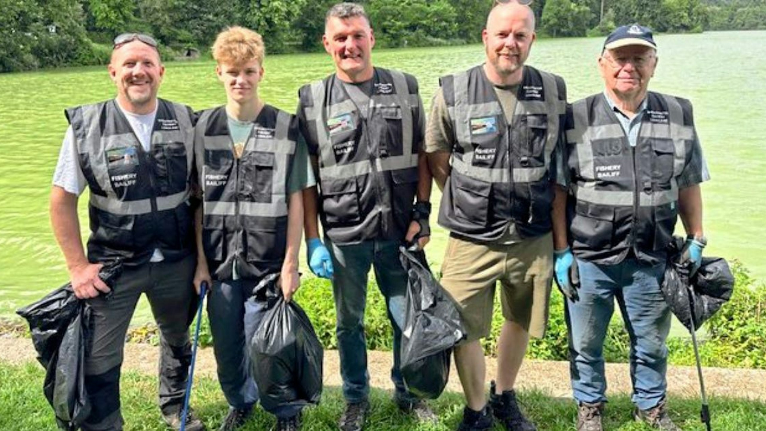 Anglers helping clean up a local pond litter picking