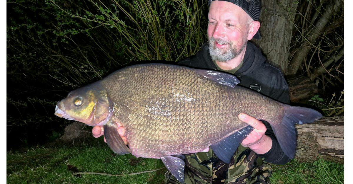 Angler holding a massive bream