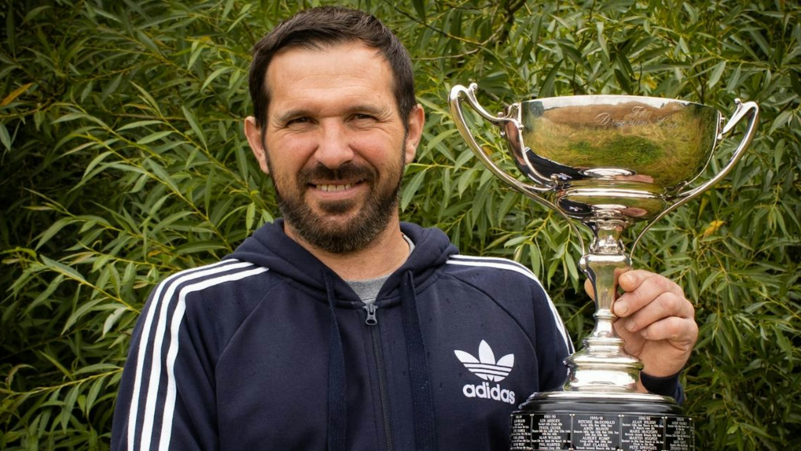 Simon Daley holding the Drennan Cup