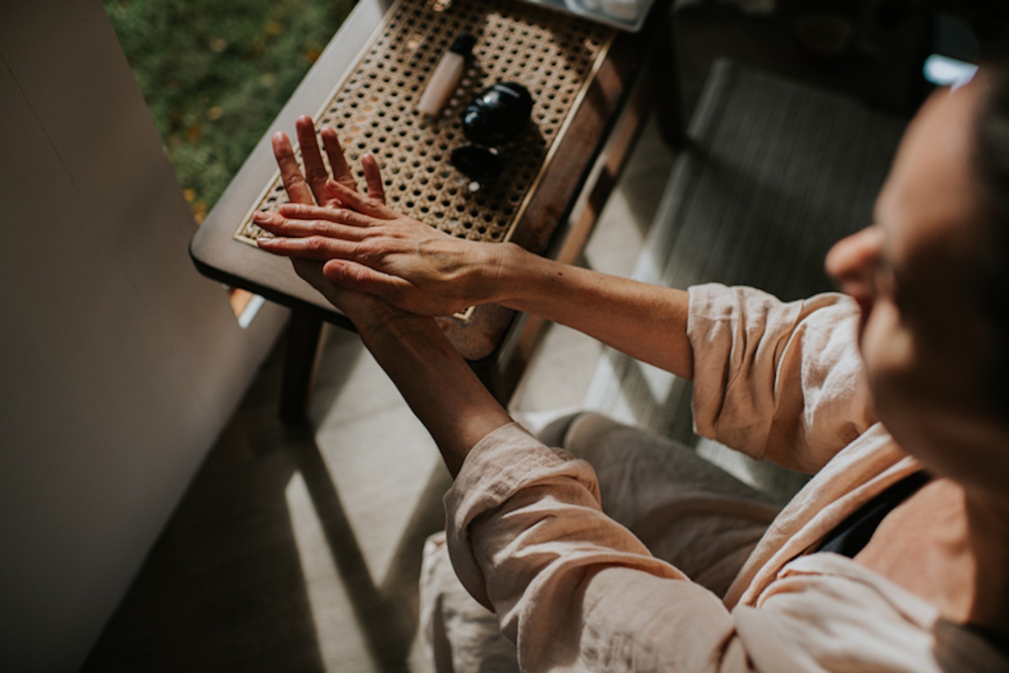 A woman moisturises her hands