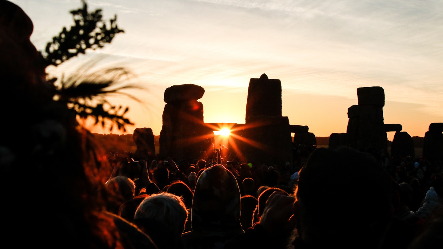 Crowds celebrating summer solstice and the dawn of the longest day of the year at Stonehenge on June 21, 2018 in Wiltshire, England.