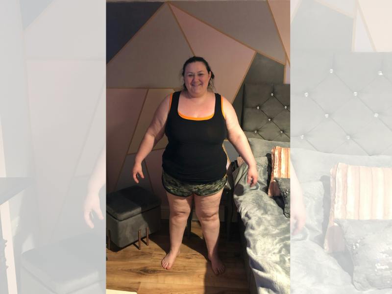 Woman in black vest and shorts