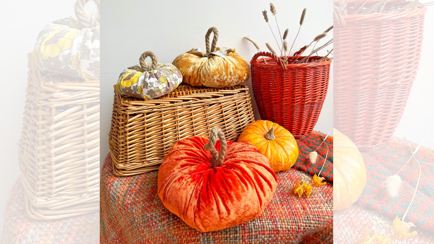 Velvet and fabric pumpkins displayed on a table