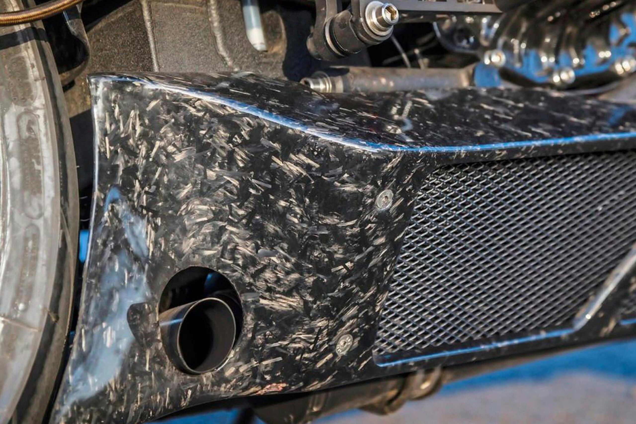 Right belly pan houses the radiator; oil cooler on the left