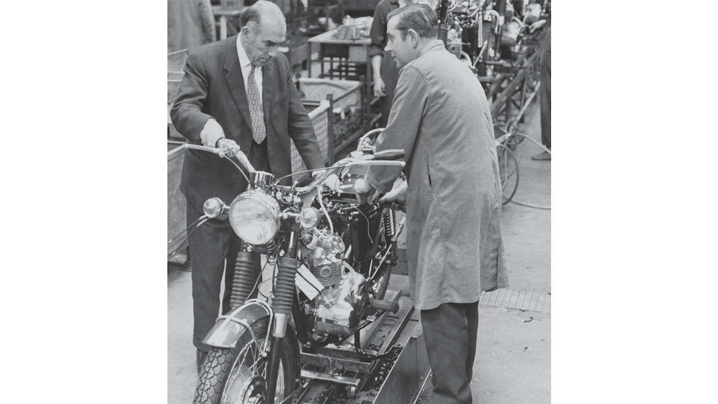 Bert Hopwood (left) getting hands-on on the production line