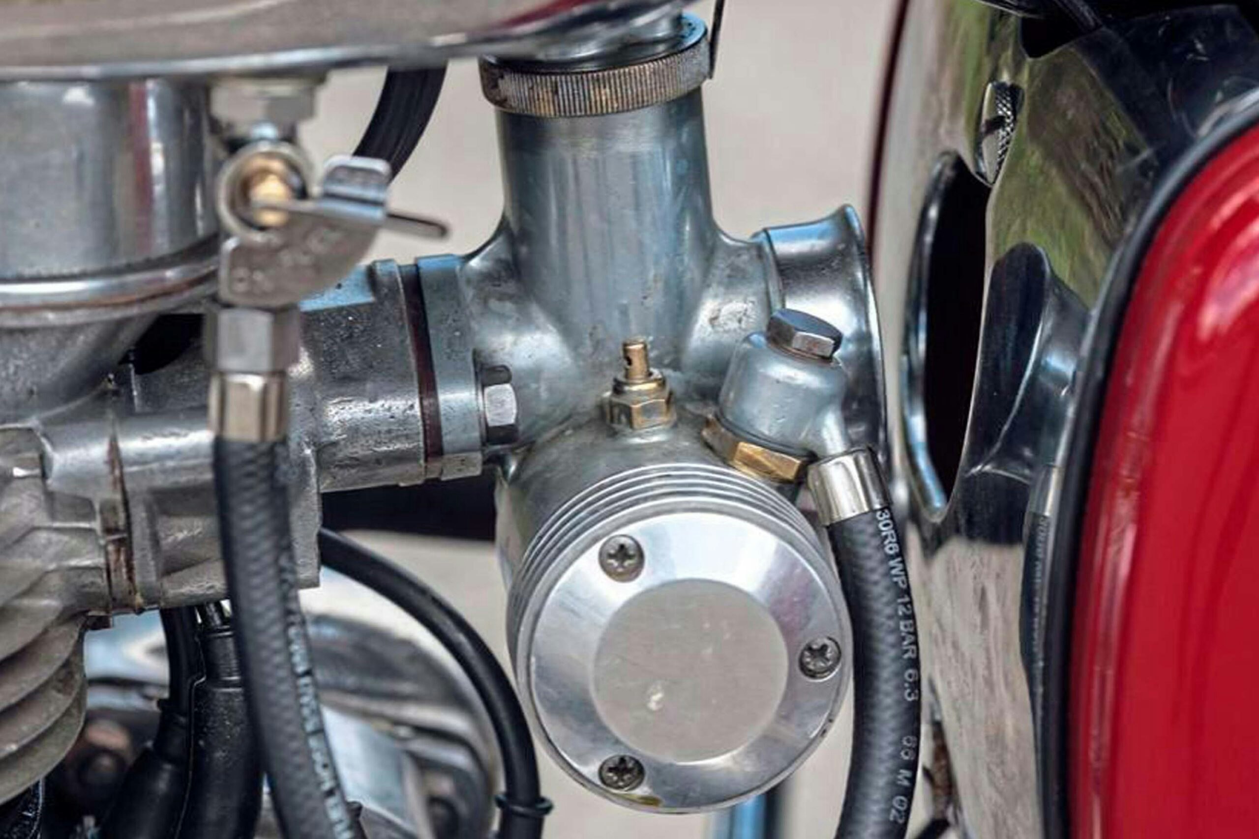 A single Amal Monobloc feeds both the cylinders