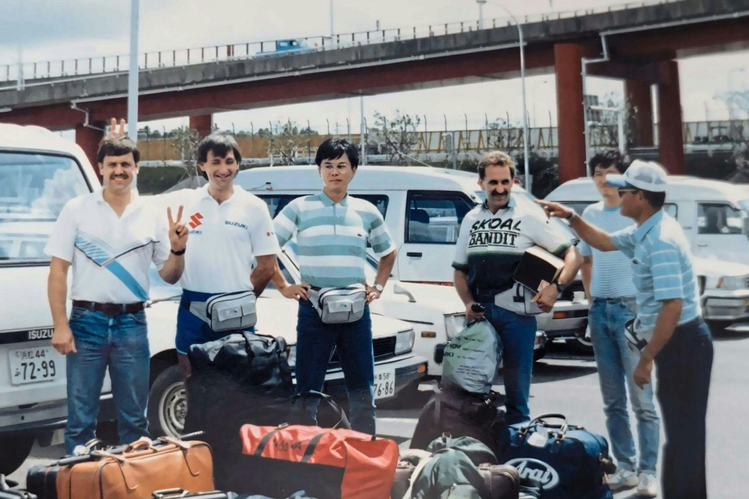 At Narita in Japan in 1987 for the F1 TT race at Fuji. Paul is on the far left next to rider Paul Iddon. Roger Marshall is in the Skoal Bandit kit